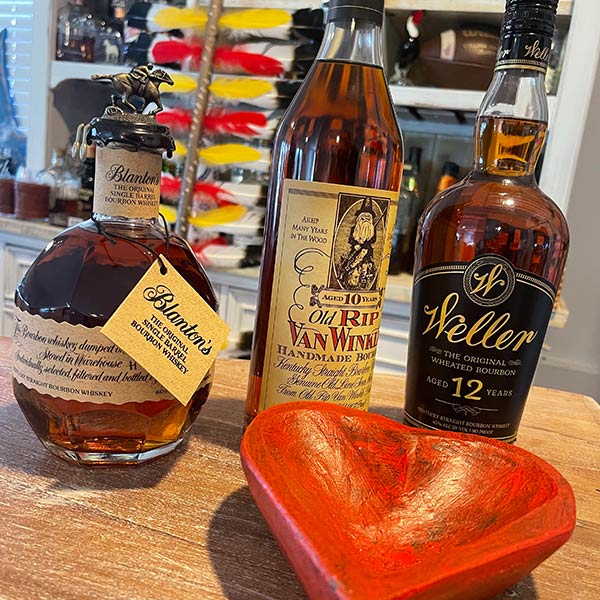 Bourbon bottles in front of a heart