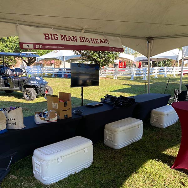Big Man Big Heart tent with coolers underneath