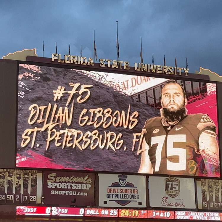 Dillan Gibbons on the big screen at a football game