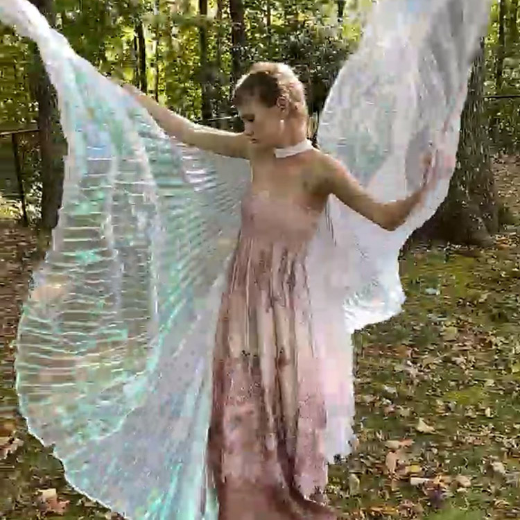 Liana Joy with beautiful wings and a dress